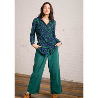 Pretty Vacant collared blouse in green with large floral pattern in dark blue. Front view.