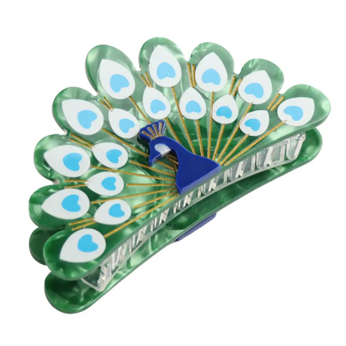 Resin claw clip in the shape of a peacock with its feathers out. 