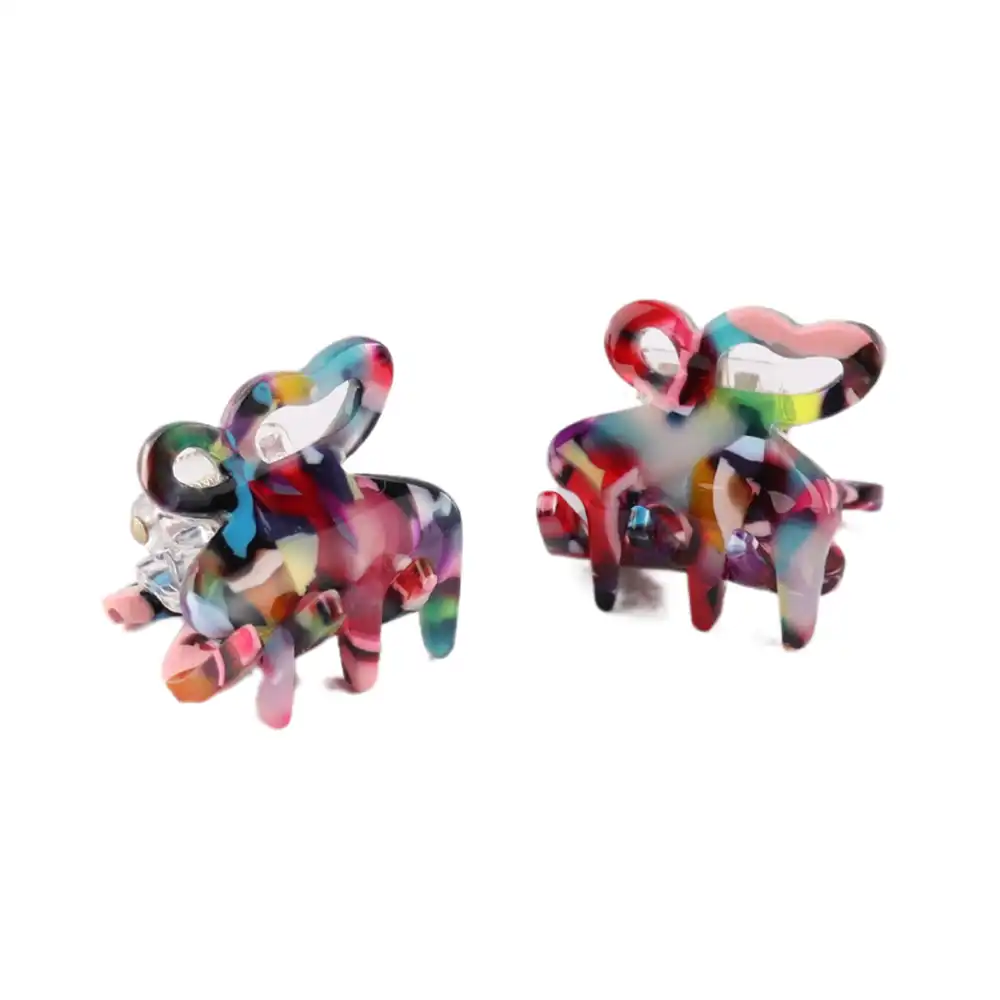 Picture of two mini hair claw clip  in multi coloured plastic on a white background. 