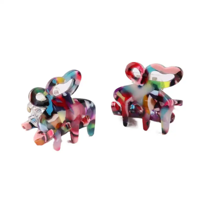 Picture of two mini hair claw clip  in multi coloured plastic on a white background. 