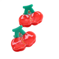 Picture of two mini hair claw clip  in red cherry design plastic on a white background. 
