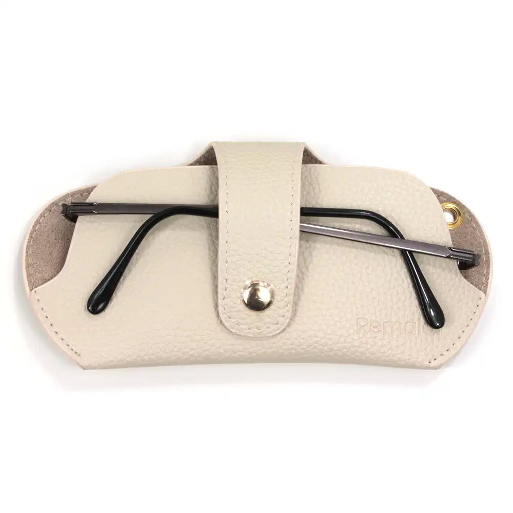 Beige glasses case with black glasses inside on a white background