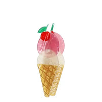 Hair clip in the shape of an ice cream cone on a white background.