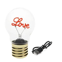 light bulb with word 'love' in pink in he middle