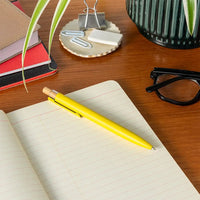 Yellow pen on a lined piece of paper