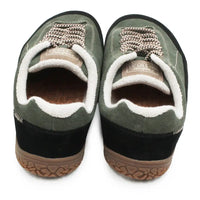 A pair of Vans slip-on sneakers in olive green suede with white sherpa lining, brown laces, and black soles, shown from a top-down view on a white background.