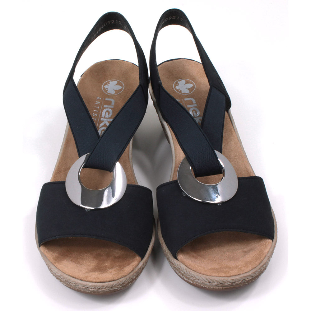 Rieker navy blue peep toe sandals. Mid height heels. Silver ring connection ankle strap. Elasticated ankle strap in matching navy. Front view.
