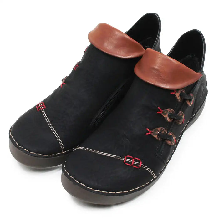 A pair of black faux leather ankle boots with brown faux leather collar trim, decorative red stitching, and brown-and-red patterned laces, shown on a white background.