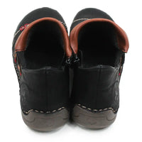 A pair of black faux leather slip-on shoes with brown faux leather trim around the collar and a dark gray sole, shown from a back-facing angle on a white background.