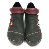 A pair of dark olive green faux leather ankle boots with burgundy faux leather collar tabs, decorative red and yellow laces, and white contrast stitching on a white background.