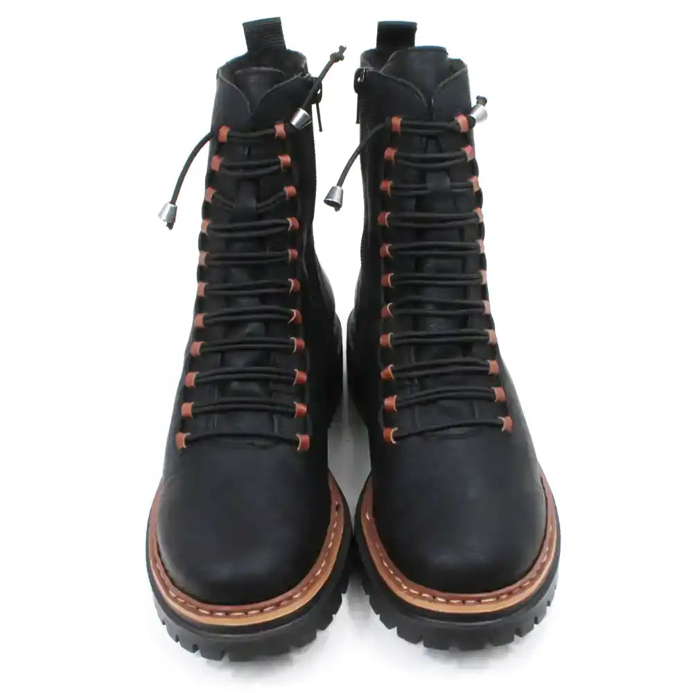 Pair of black laced boots with brown accents on a white background