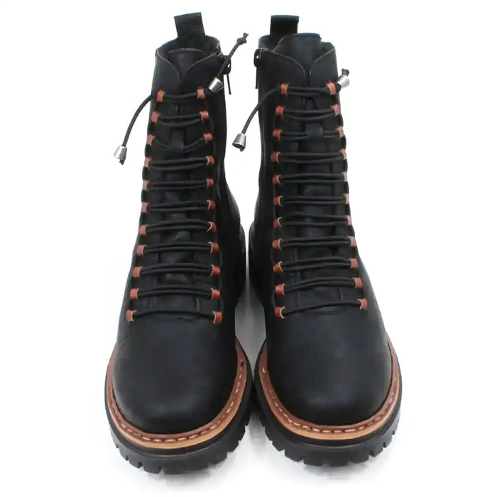 Pair of black laced boots with brown accents on a white background