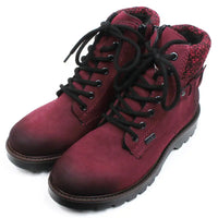 Rieker walking and activity boots in deep crimson. Black round laces in a 7 hole adjustment. Zip fastening. Wool cuffs a the ankles in a complementary mottled colour. Buckle detail at the ankle. Chunky deeply treaded soles. Angled view.