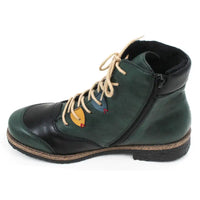 Green and black boot with a zip on the inside of the boot on a white background