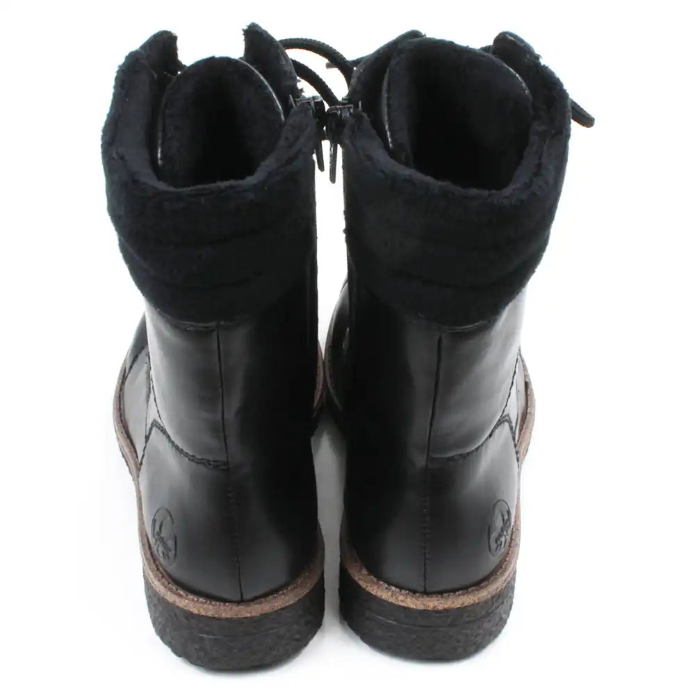 Pair of black leather boots on a white background