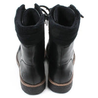 Pair of black leather boots on a white background