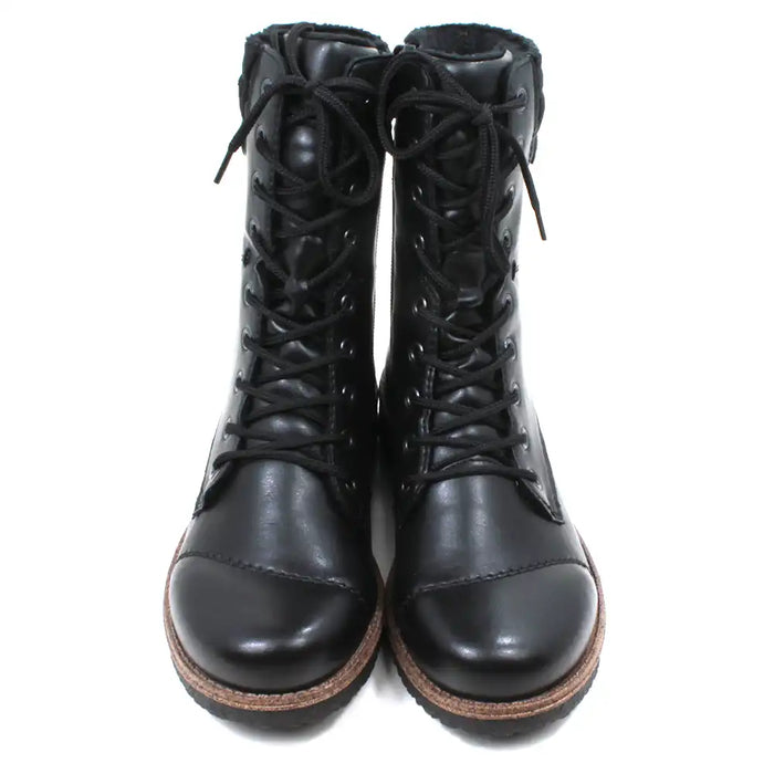 Pair of black leather boots with brown soles on a white background