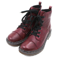 Pair of maroon combat boots with black laces on a white background