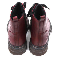 Pair of maroon combat boots with black laces on a white background