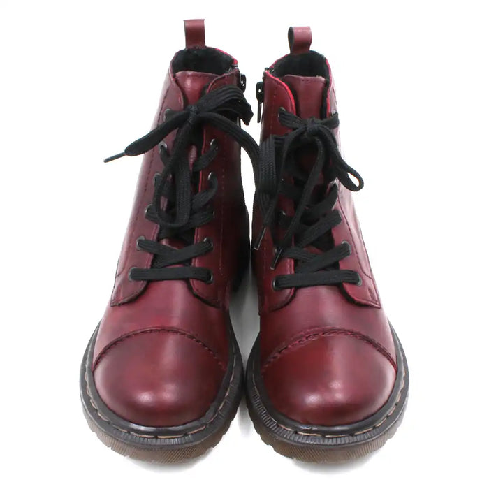 Pair of maroon combat boots with black laces on a white background