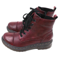 Pair of maroon combat boots with black laces on a white background