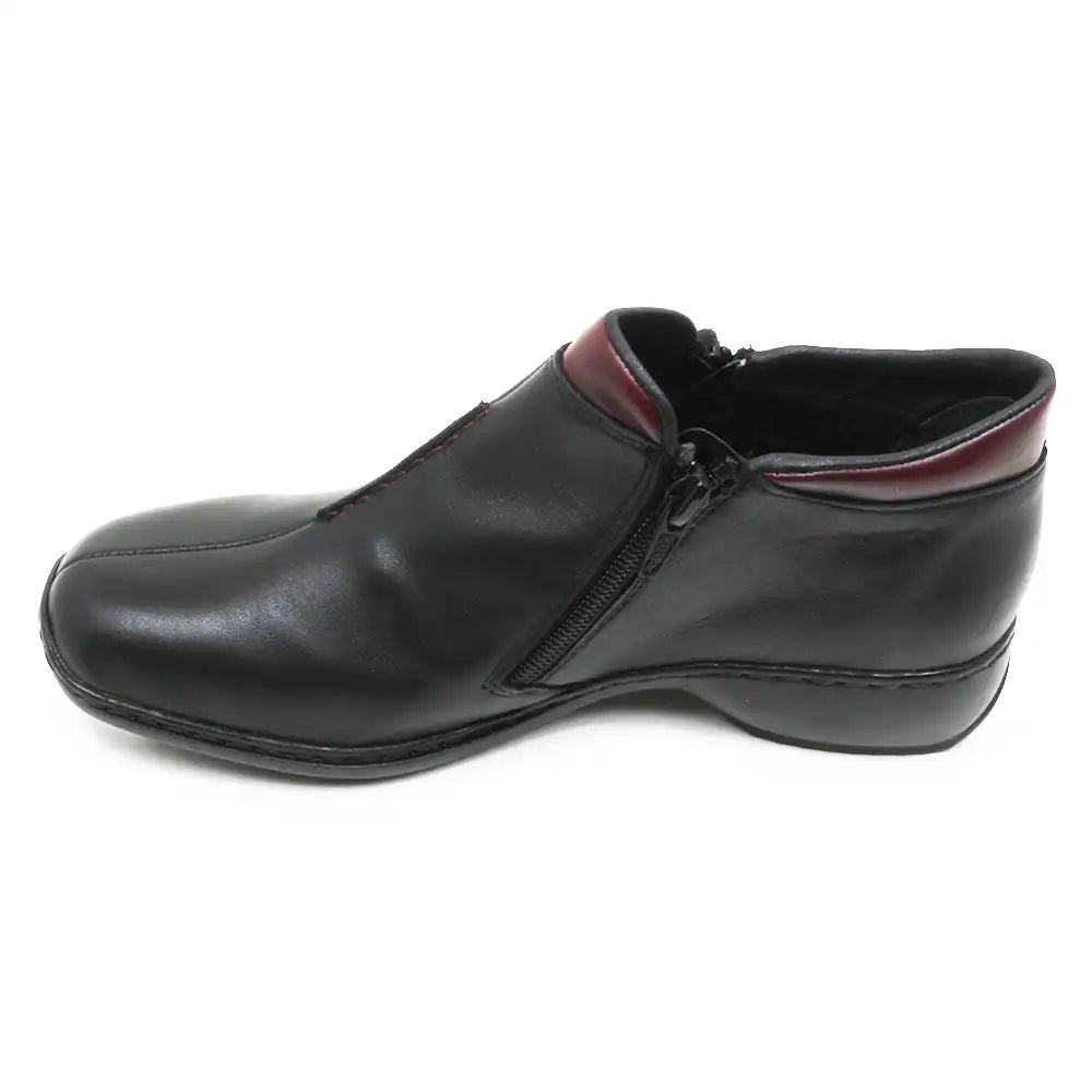 A black leather slip-on shoe with a side zipper and a contrasting burgundy inner collar, shown from a side profile on a white background.