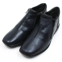 Rieker navy blue shoes. Zip fitting. Simple laceless design. Black soles with low heels. Angled view.