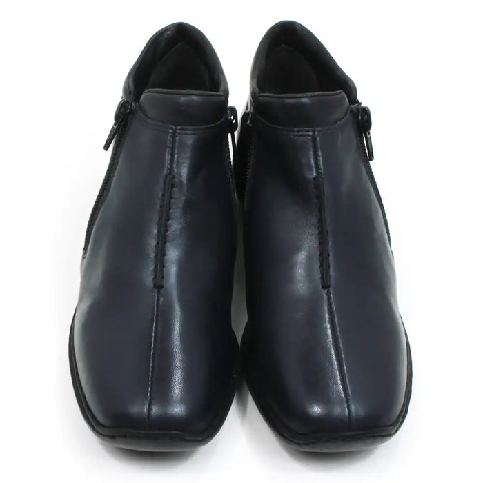 Rieker navy blue shoes. Zip fitting. Simple laceless design. Black soles with low heels. Front view.