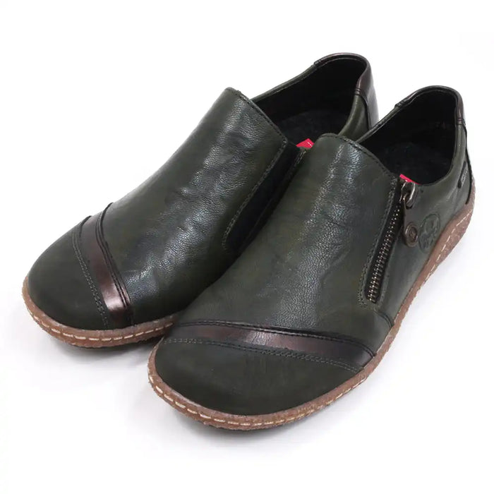 Rieker green flat everyday shoes with faux zip detail and rubber soles. Angled view.