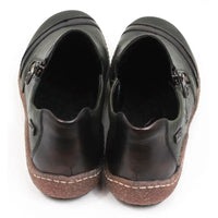 Rieker green flat everyday shoes with faux zip detail and rubber soles. Back view.