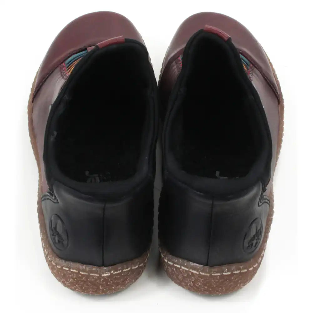 Pair of maroon leather shoes with multicolored striped design on a white background. Back view.