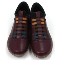 Pair of maroon leather shoes with multicolored striped design on a white background. Front view.