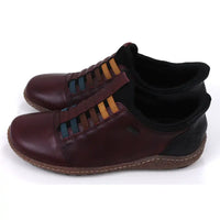 Pair of maroon leather shoes with multicolored striped design on a white background. Side view.