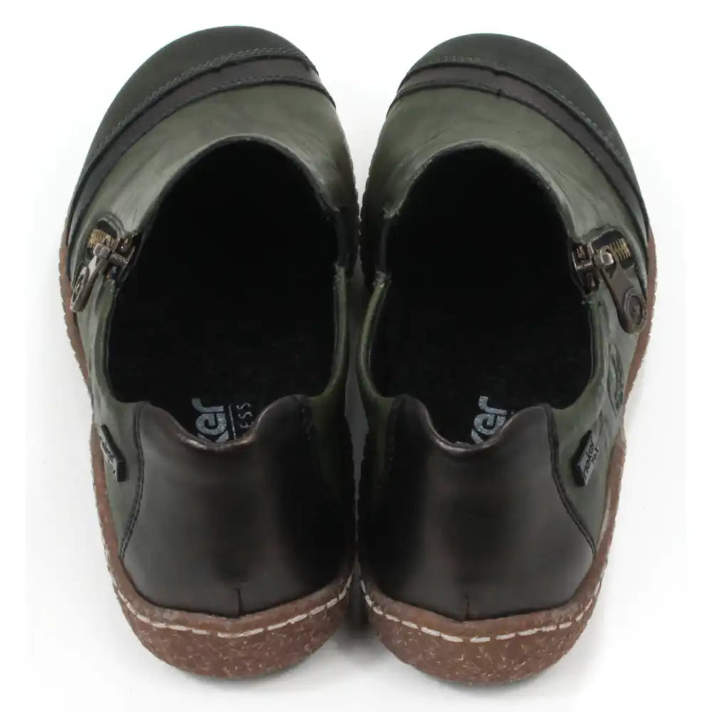 Pair of dark green leather shoes with zips on a white background. Back view.