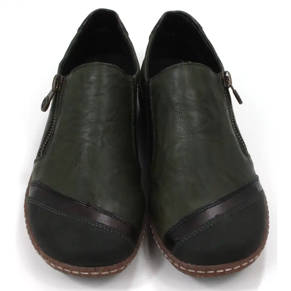 Pair of dark green leather shoes with zips on a white background. Front view.