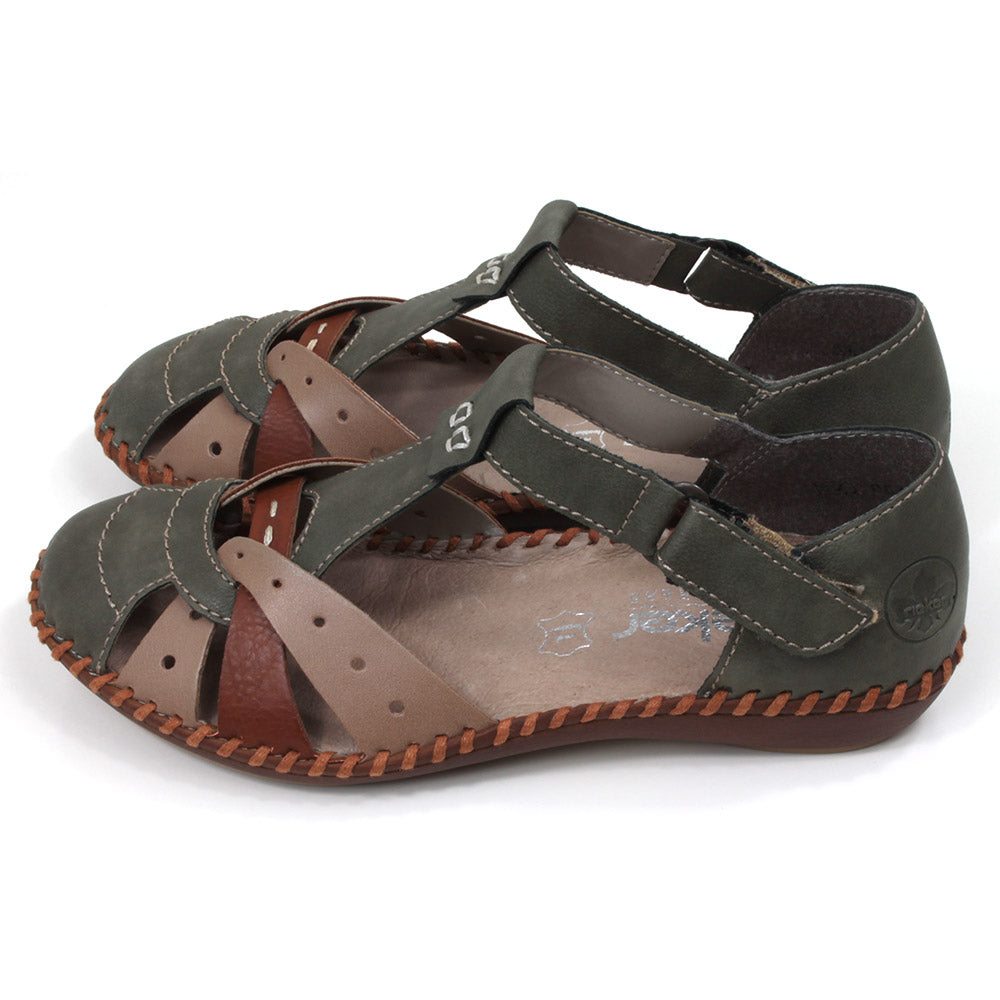 Rieker sandals in green, tan and beige combination. Velcro fitting and adjustment over the ankle. Side view.