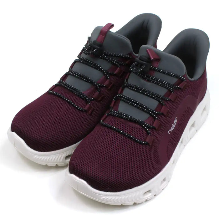 Rieker burgundy trainers in lightweight fabric and white soles. Grey ankle padding and tongues. Elasticated adjustment across the feet. Angled view.