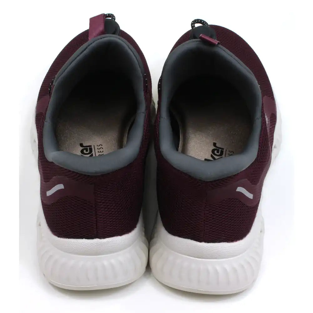 Rieker burgundy trainers in lightweight fabric and white soles. Grey ankle padding and tongues. Elasticated adjustment across the feet. Back view.