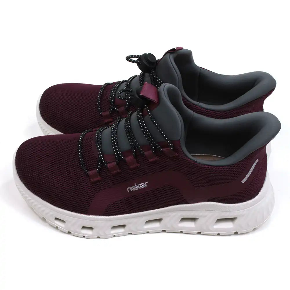 Rieker burgundy trainers in lightweight fabric and white soles. Grey ankle padding and tongues. Elasticated adjustment across the feet. Side view.