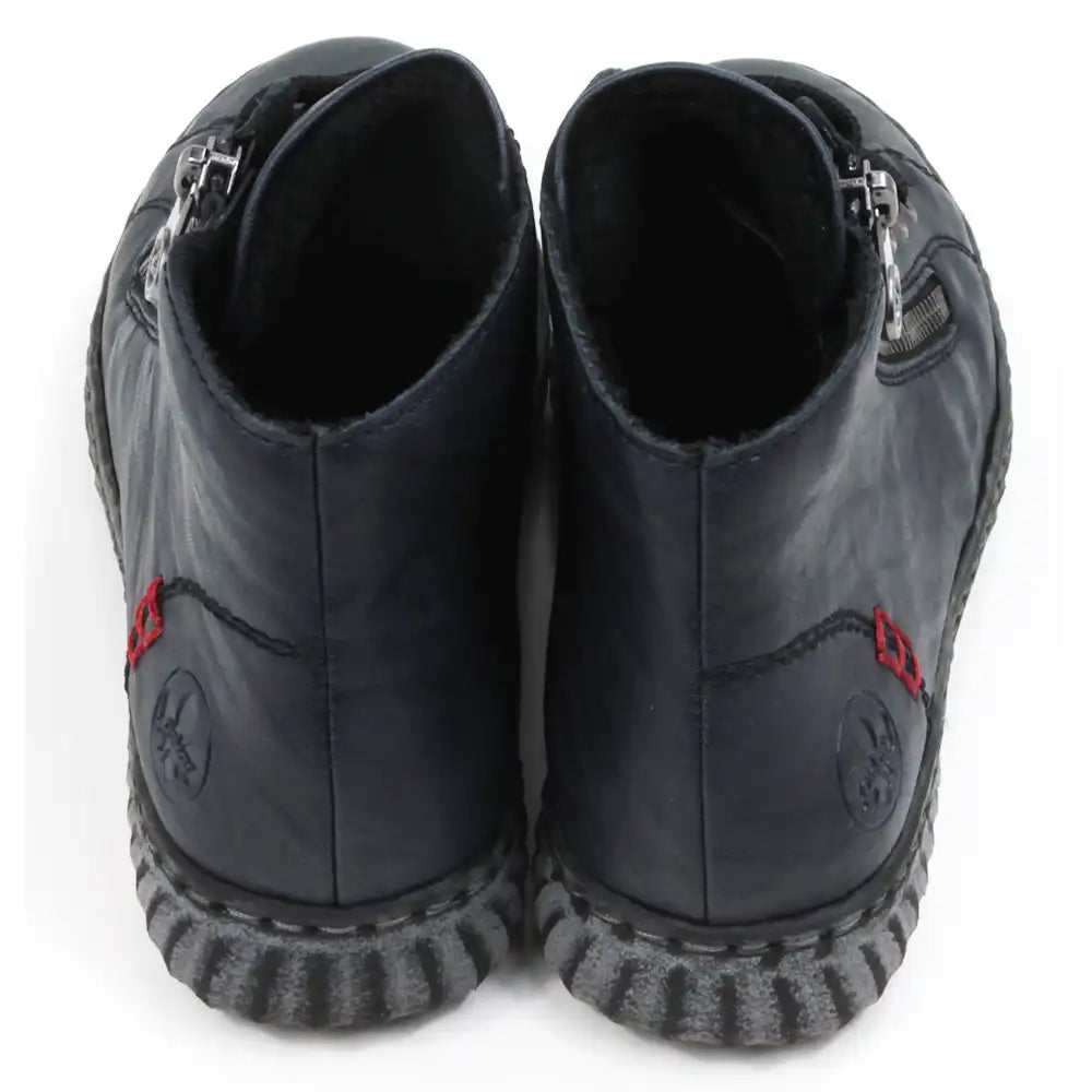 Pair of navy ankle boots with zippers and adjustment laces. Back view.