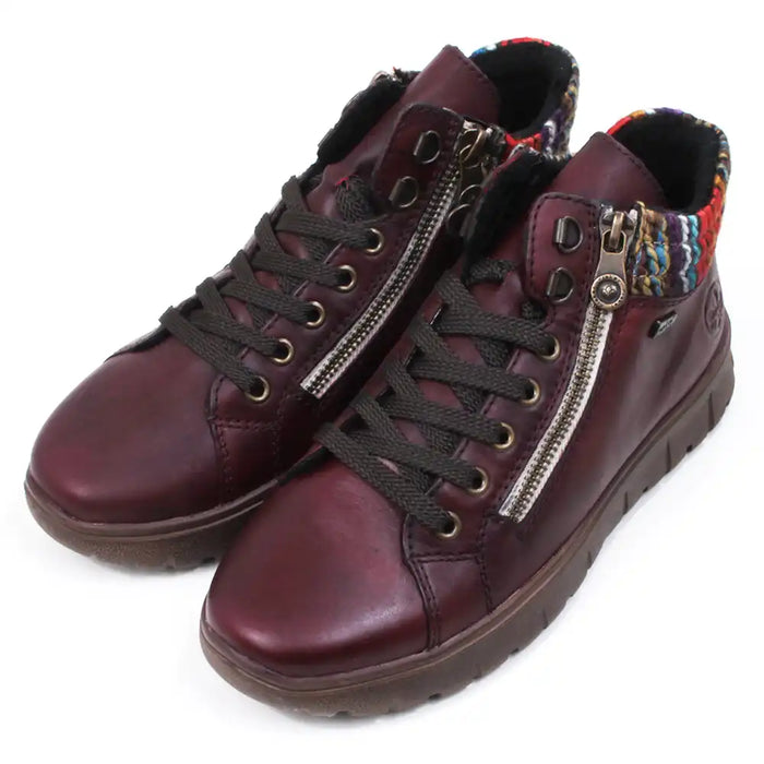 Maroon ankle boots with zippers and knitted ankle cuffs on a white background