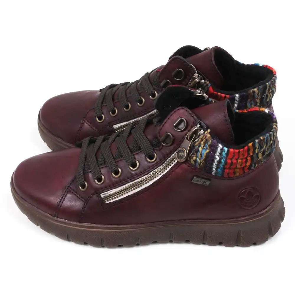 Maroon ankle boots with zippers and knitted ankle cuffs on a white background