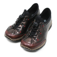 A pair of dark brown leather lace-up shoes with black laces, black elastic ankle straps, and small red stitching accents, shown on a white background.