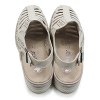Beige cut out pattern sandals with back straps on a white background.