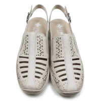 Beige cut out pattern sandals with back straps on a white background.