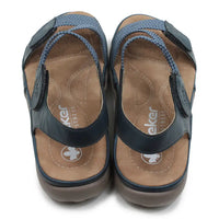 Blue fabric strapped sandals on a white background.