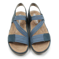 Blue fabric strapped sandals on a white background.