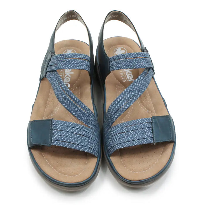 Blue fabric strapped sandals on a white background.