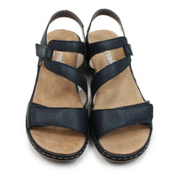 Dark blue strappy sandals on a white background.