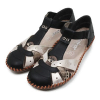 Pair of black and snakeskin sandals with patterned soles on a white background